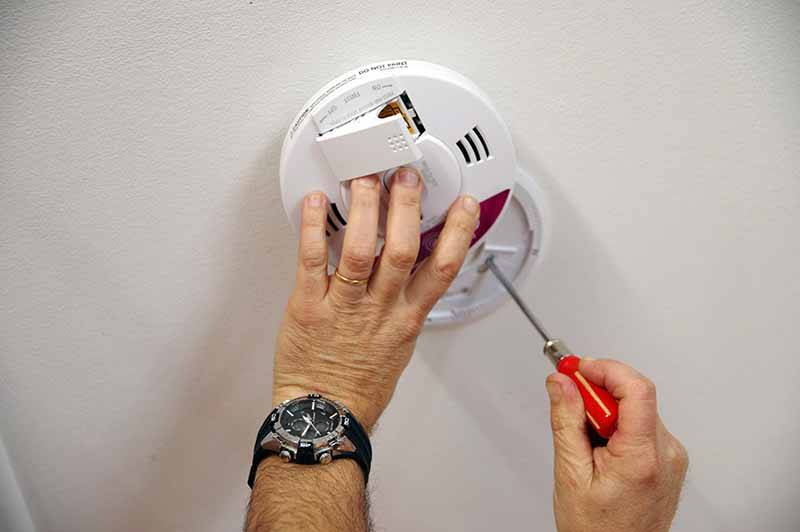 fire alarm being fitted